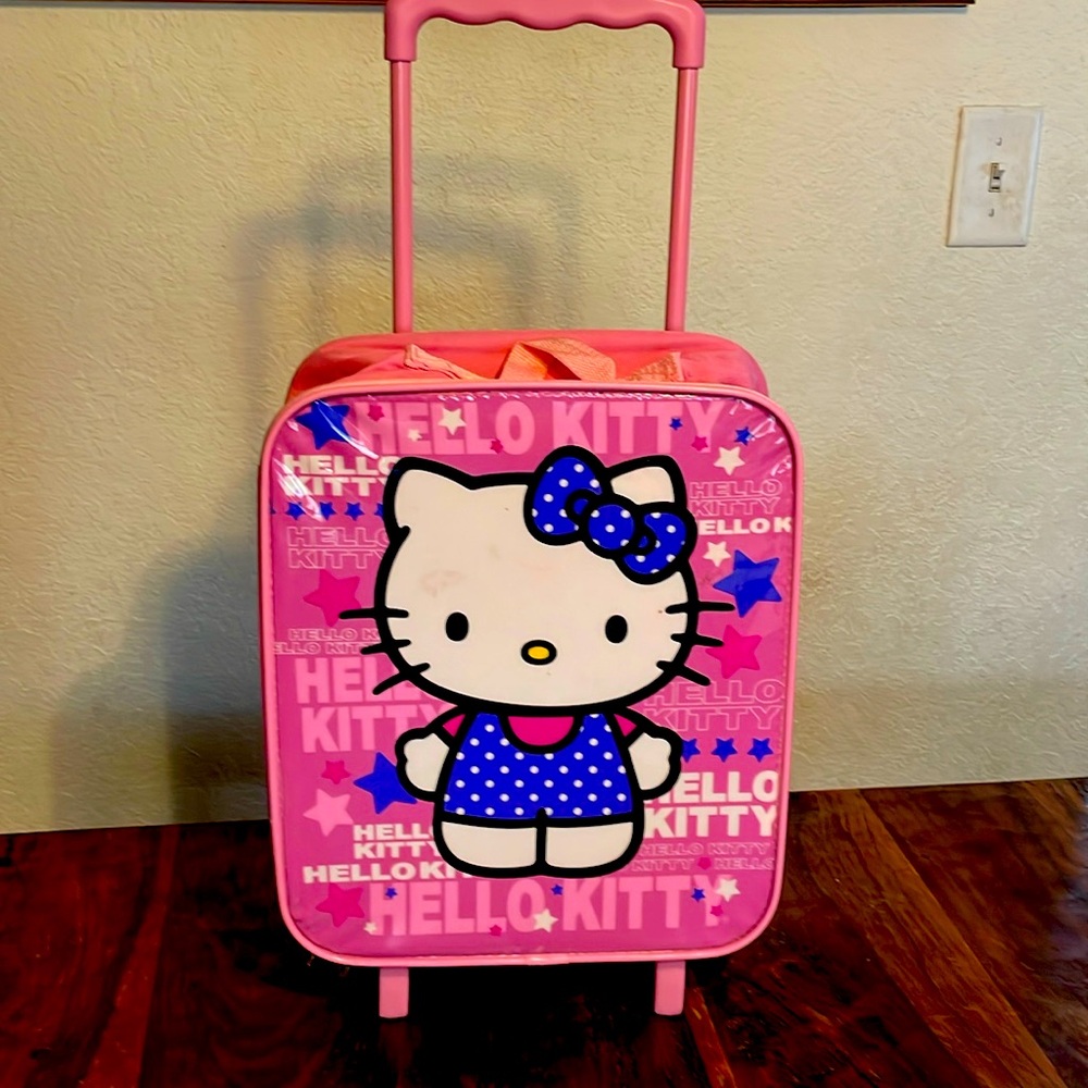Hello Kitty suitcase on wheels for kids.